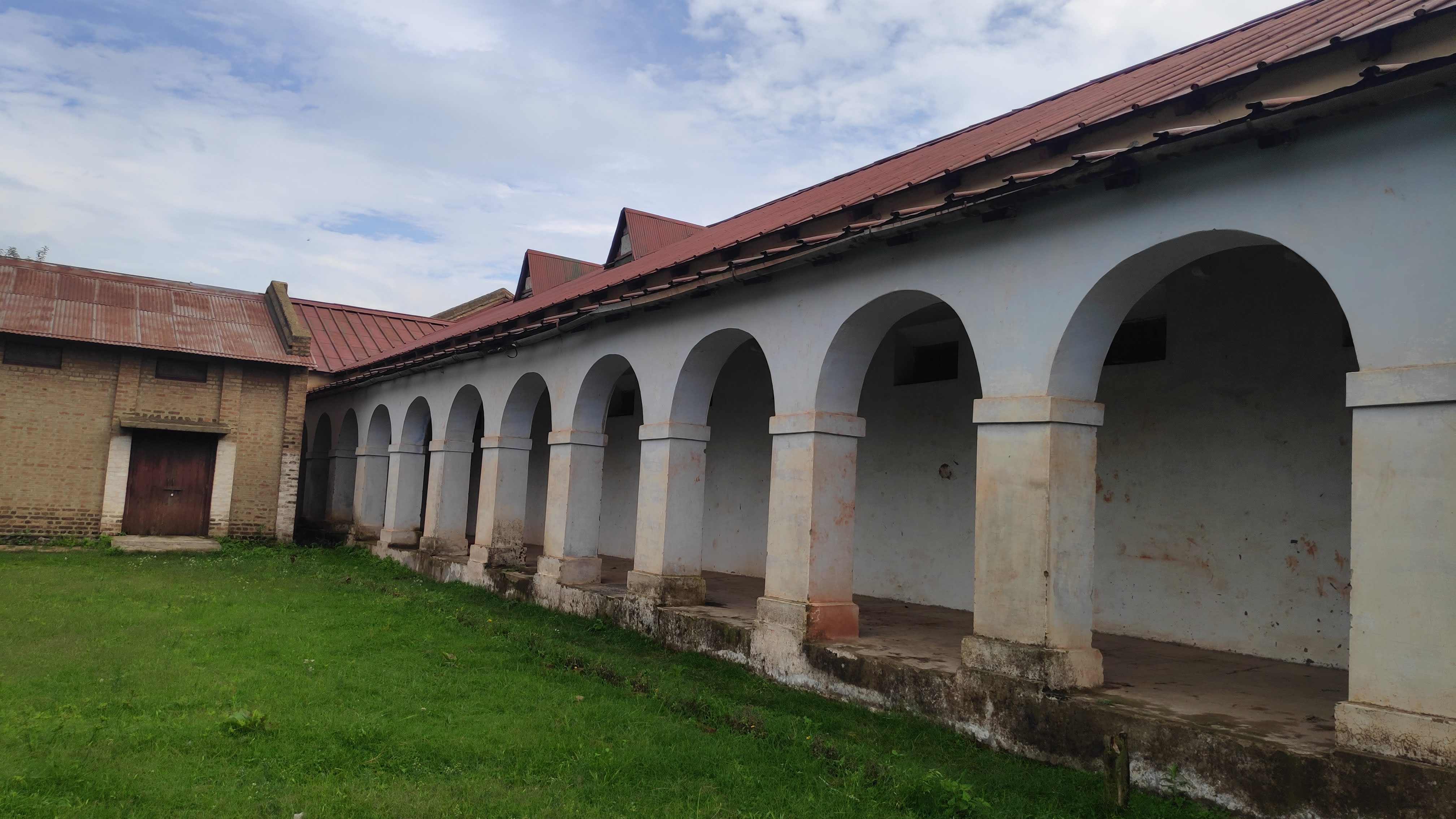 Historic arched courtyard and garden at Dagshai Jail Museum