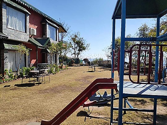 Slide and outdoor play space beside the resort building