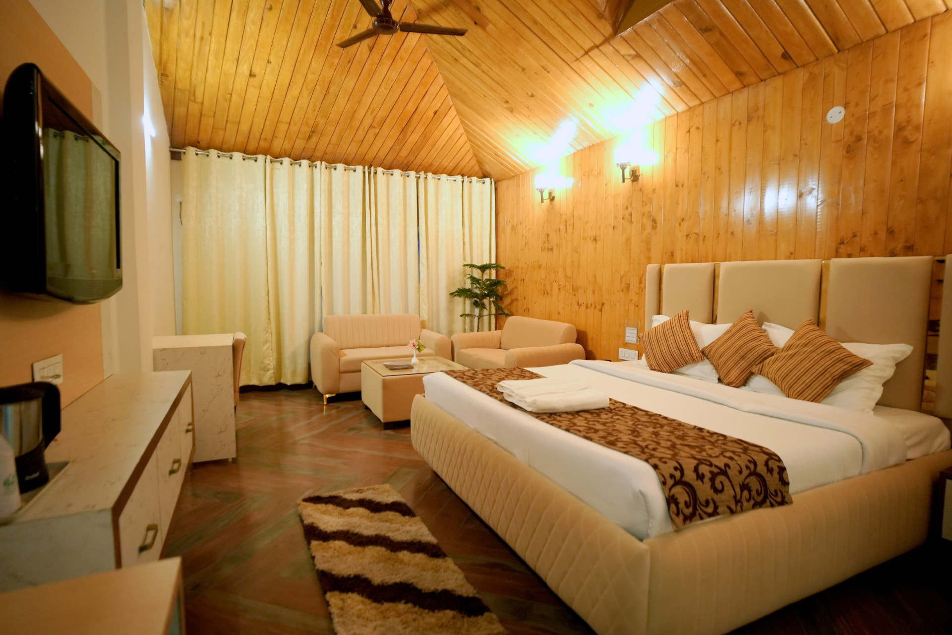 Log Hut with wood panelling, upholstered bed and seating