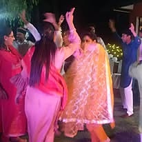 Guests dancing at an evening celebration