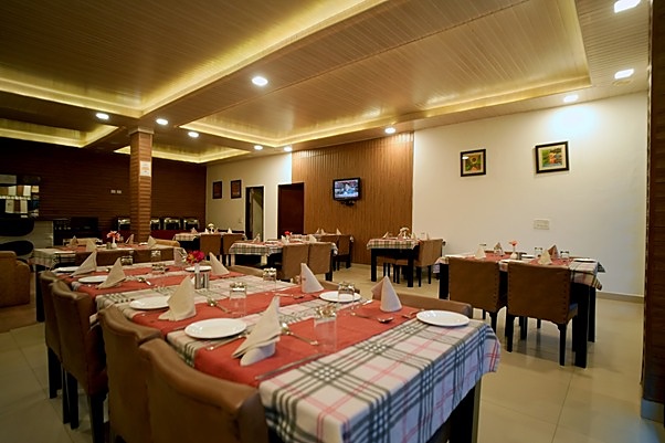 Restaurant tables laid with checked cloths