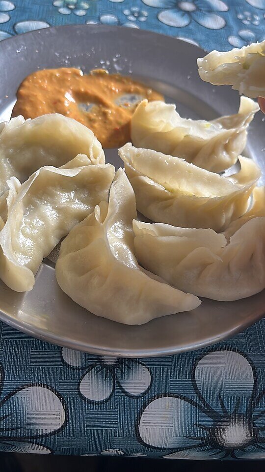 A plate of steamed momos